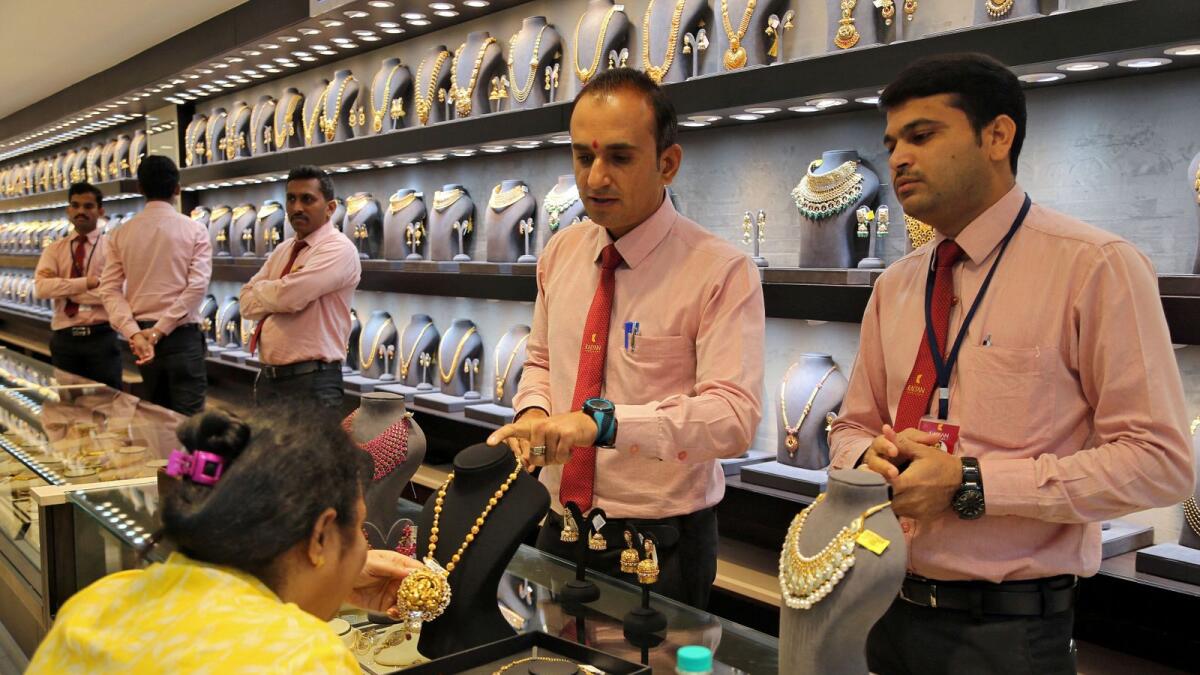A jewellery showroom in Mumbai. Gold demand during the March quarter fell to 112.5 tonnes. — Reuters