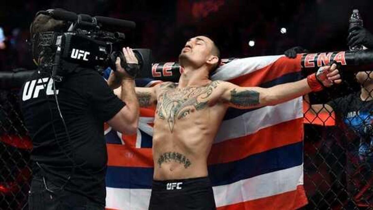 Max Holloway celebrates his victory against Calvin Kattar at UFC Fight Night on Saturday in Abu Dhabi. — Twitter