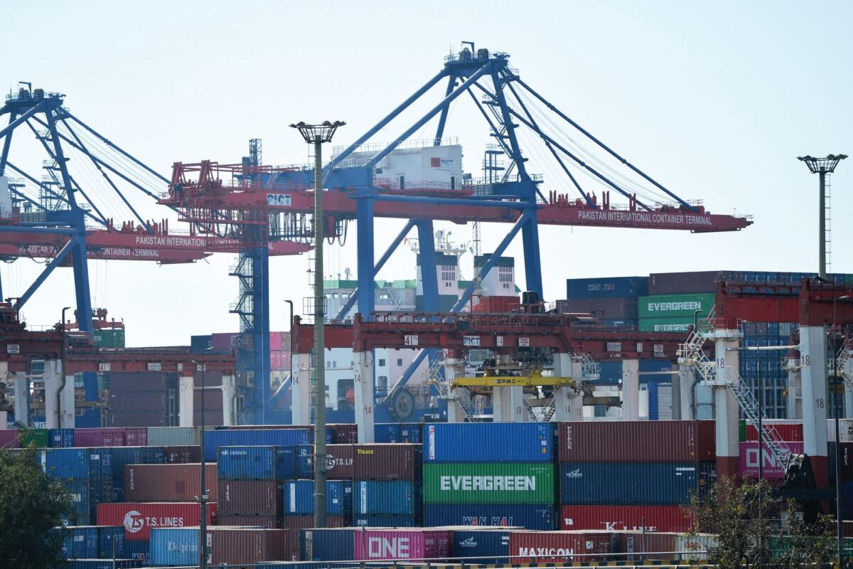 Shipping containers are seen placed under cranes at the Karachi sea port. Pakistan, the fifth most populous country and 41st largest economy of the world, has been growing at an average rate of 2.89 per cent in the past five years despite the Covid-19 crisis, slowdown in global economy and higher commodities in the international market. — AFP
