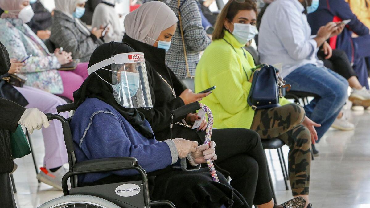 People wait for their turn to be vaccinated for Covid-19 in the Mishref suburb south of Kuwait City. — AFP file