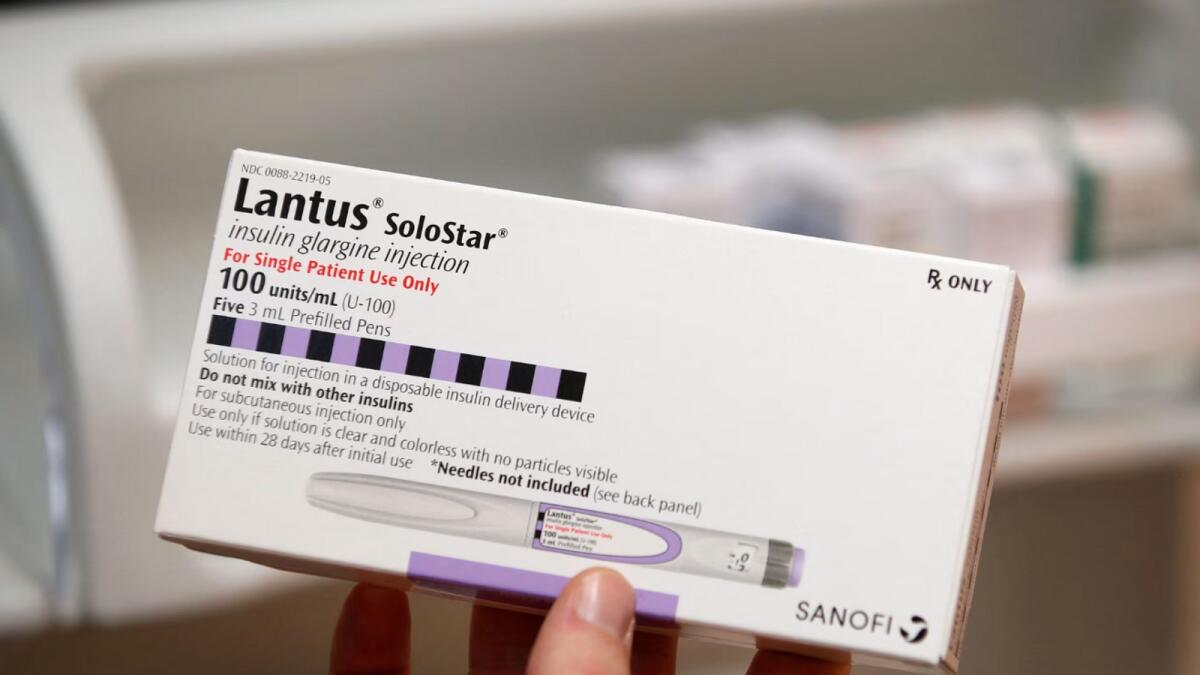 A pharmacist holds a box of the drug Lantus SoloStar, made by Sanofi Pharmaceutical, at a pharmacy in Provo, Utah. - Reuters file