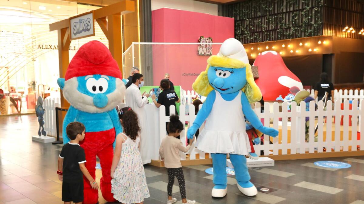 Smurf smiles.  The Smurfs are calling all families to City Walk! Step into the village of the small, blue, and beloved creatures who reside in quaint mushroom-shaped houses. Upon visiting ‘Smurfsphere’, little ones can indulge in a whole host of interactive activities including a Smurfs soccer field, Smurfs-themed arts and crafts workshops and a Smurffete beauty corner.