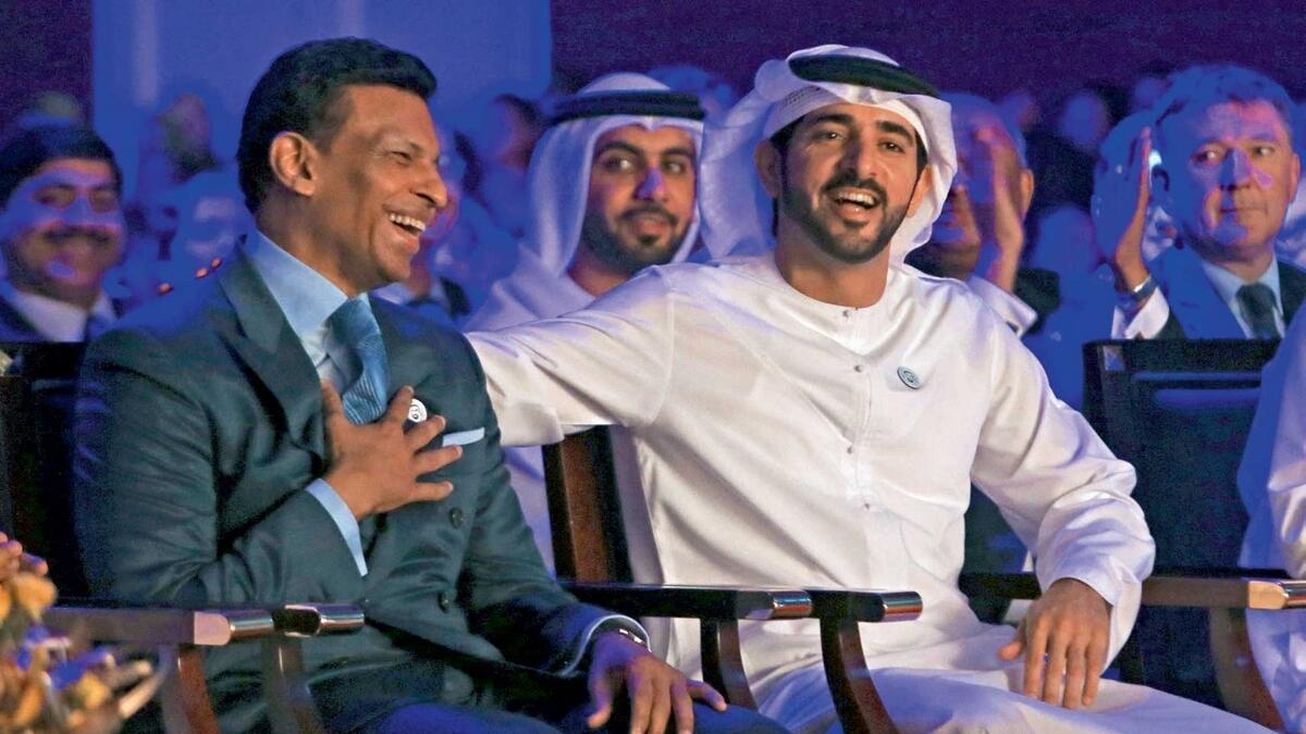 Sheikh Hamdan shares a light moment with Sunny Varkey during the golden jubilee celebrations at the GEMS Our Own English High School in Al Warqa, Dubai, on Monday. — Photo by Dhes Handumon