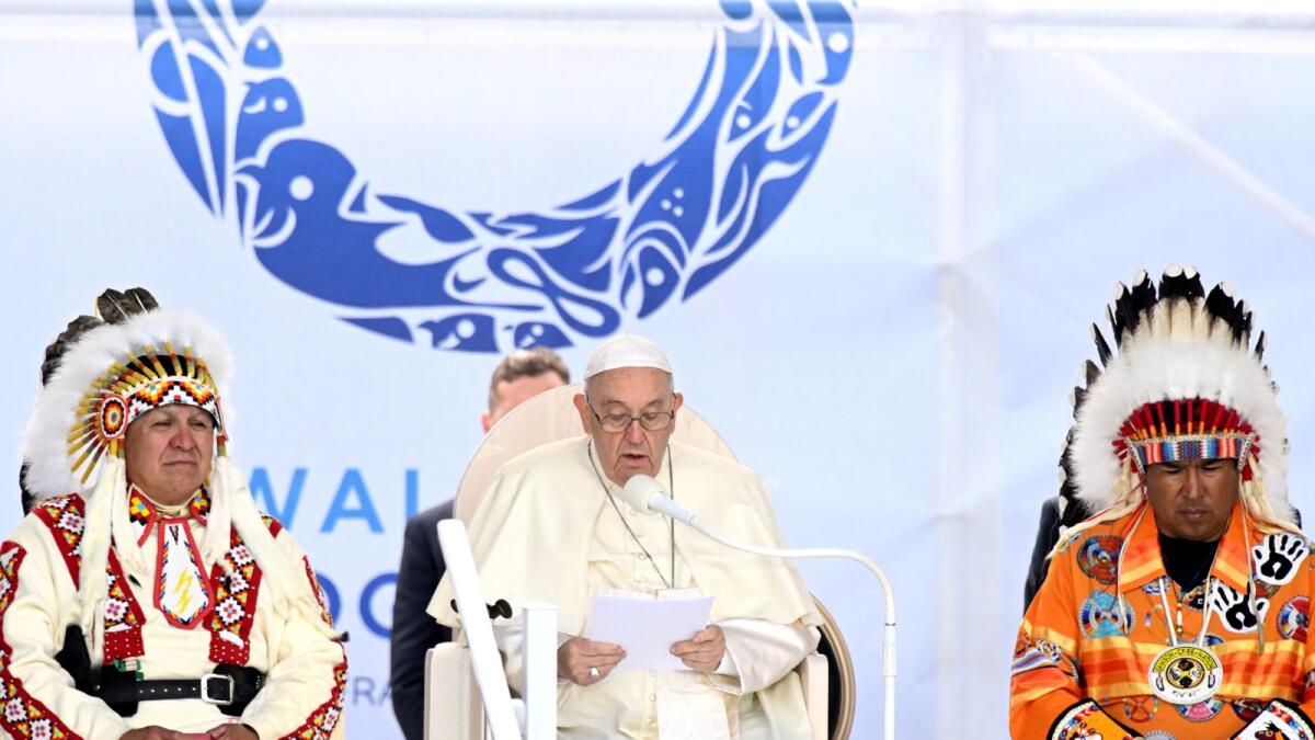 Pope Francis (C) speaks to members of the Indigenous community at Muskwa Park in Maskwacis, Alberta, Canada. Photo: AFP