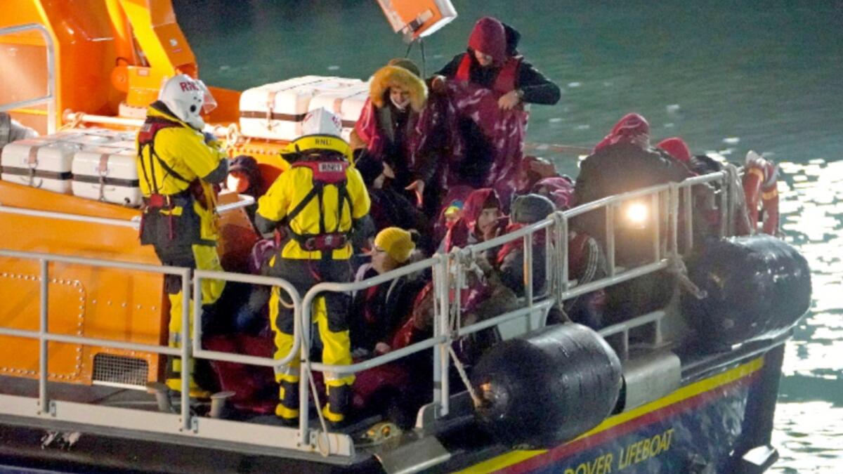 A group of people thought to be migrants are brought in to Dover, England by the RNLI, following a small boat incident in the English Channel. — AP