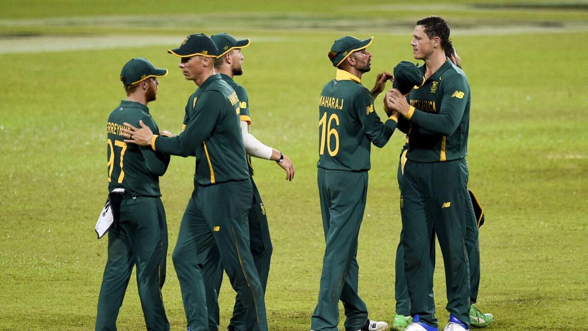 South Africa's captain Keshav Maharaj (2nd right) celebrates with teammates after South Africa won second ODI by 67 runs against Sri Lanka. — AFP