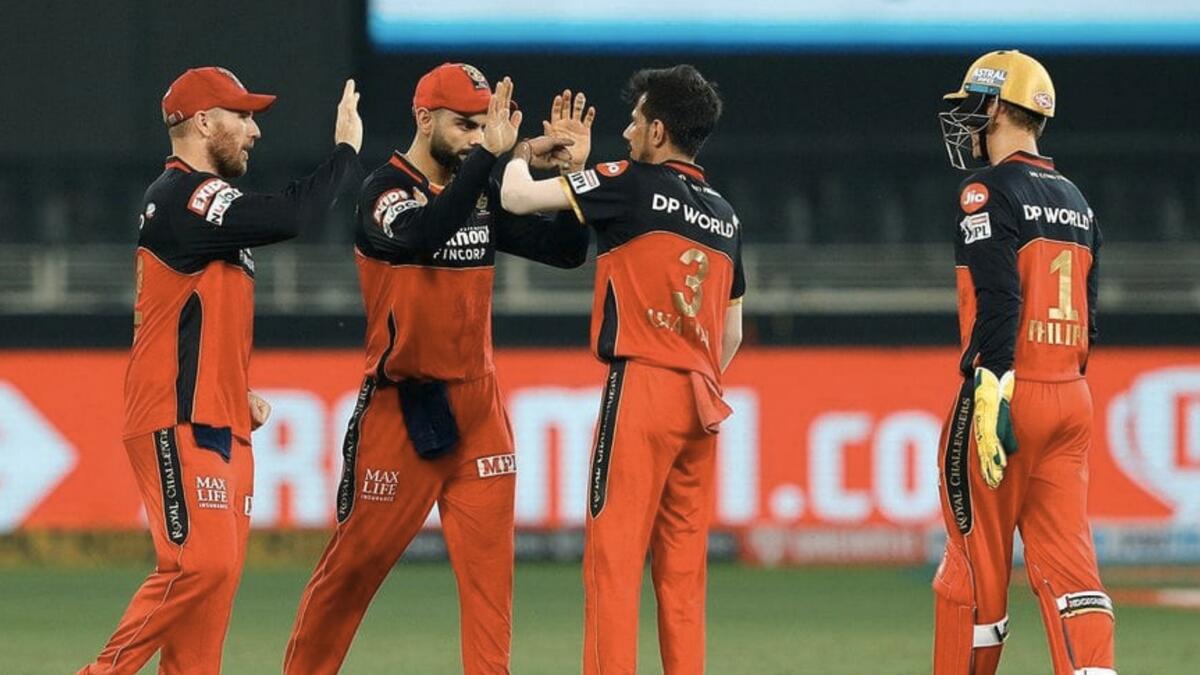 The Royal Challengers Bangalore in a team huddle during the match against Sunrisers Hyderabad. - Royal Challengers Bangalore Twitter