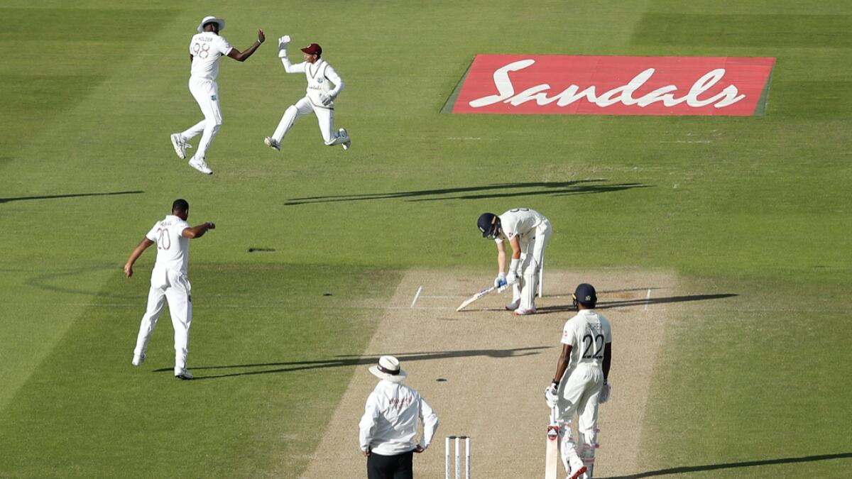 Southampton: West Indies players celebrates the dismissal of England's Dom Bess, second right, during the fourth day of the first cricket Test match between England and West Indies, at the Ageas Bowl in Southampton, England, Saturday, July 11, 2020.AP