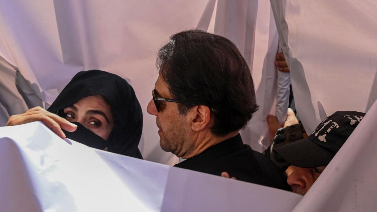 Imran Khan (right) with his wife Bushra Bibi. Photo: AFP file