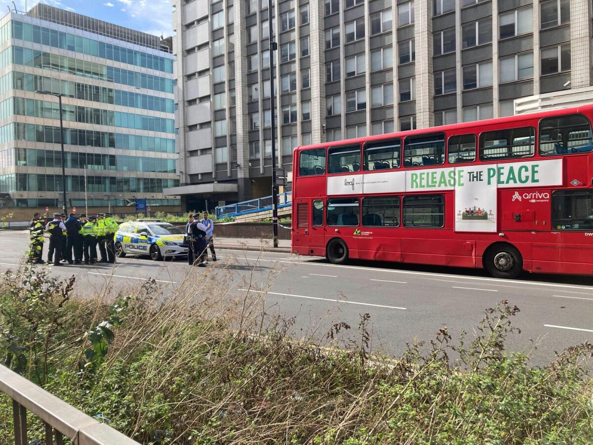 Emergency services at the scene near the Whitgift shopping centre after a 15-year-old girl was stabbed to death, in Croydon, south London, on Wednesday. — AP