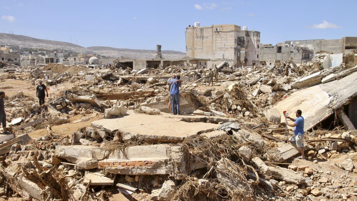 People look for survivors in Derna. — AP