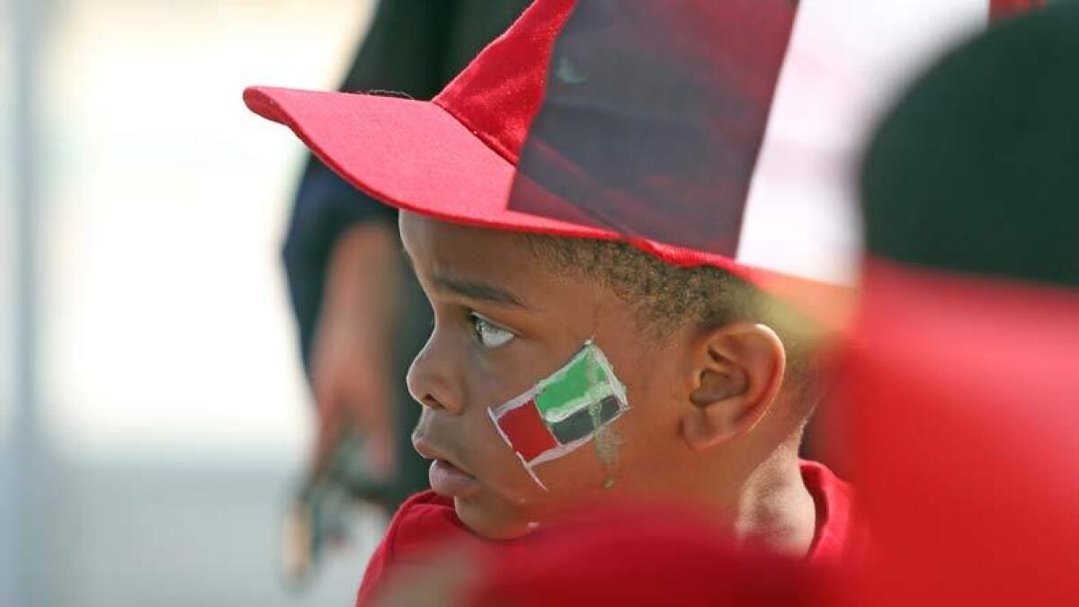A child with a UAE flag painted on his face takes part at the UAE Flag Day celebrations at the Kite Beach in Dubai. Photo by Dhes Handumon/ Khaleej Times