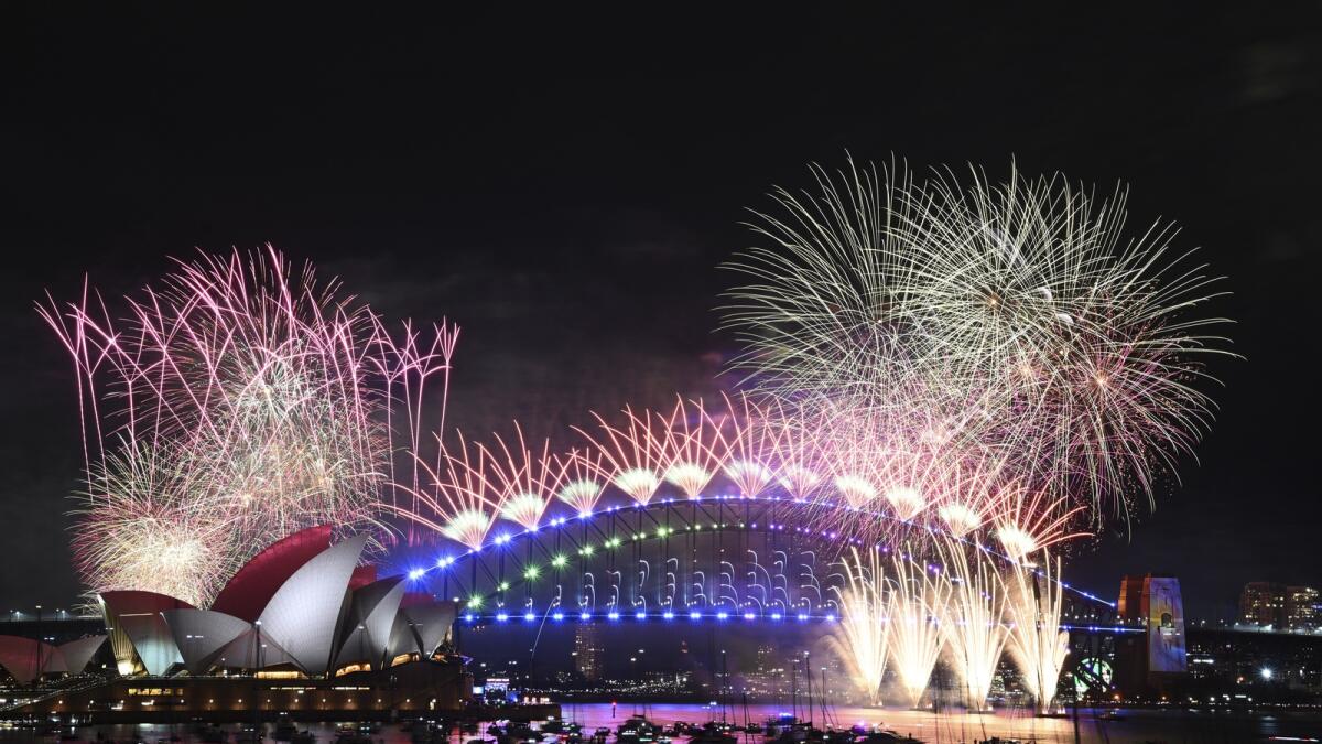 Fireworks explode over the Sydney Opera House and on the Harbour Bridge. — AP