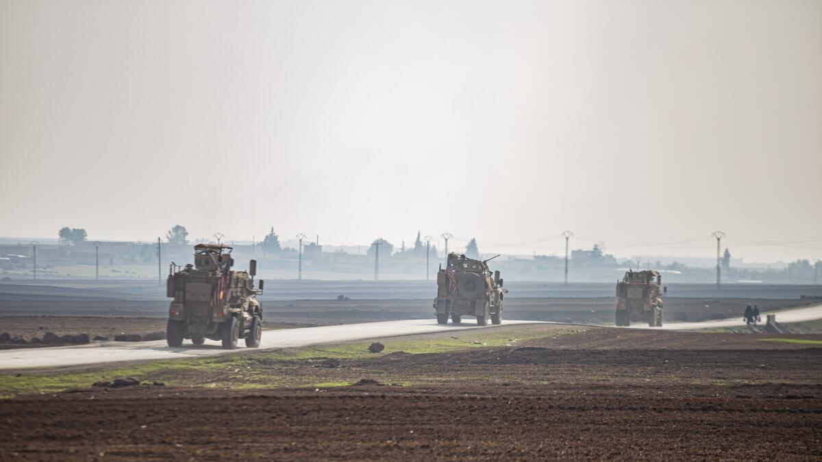 US military vehicles on a patrol in the countryside near the town of Qamishli, Syria, on December 4, 2022. — AP