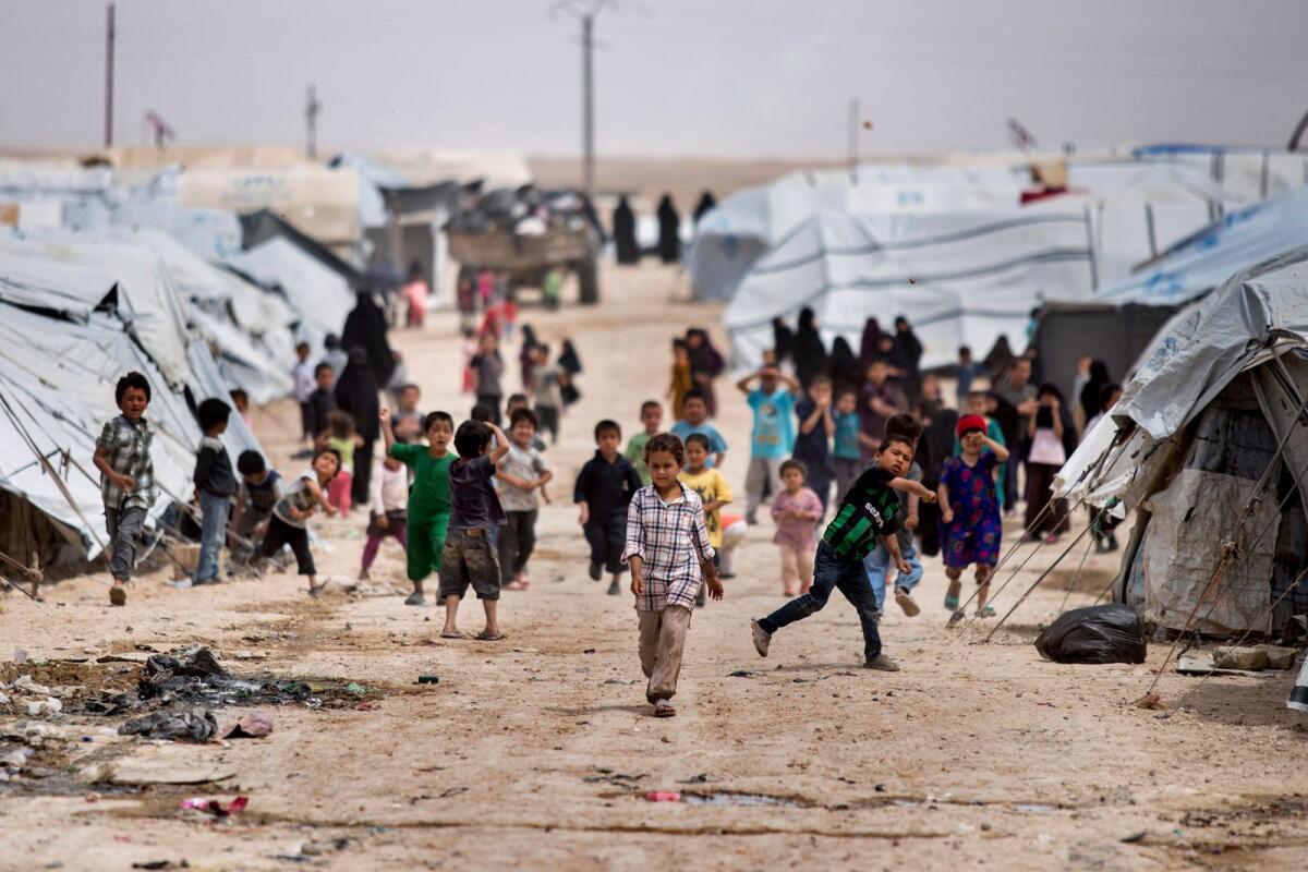 Children gather outside their tents at the Al Hol camp, which houses families of members of the Daesh group, in Hasakeh province, Syria, on May 1, 2021. — AP file