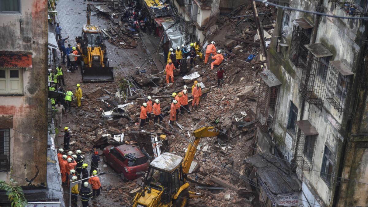 Rescue operation being carried out after a corner portion of an old six-story building collapsed at Fort area, in Mumbai, India. Photo: PTI