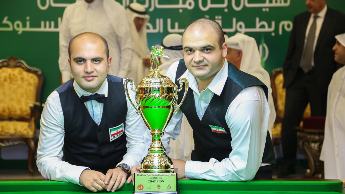 Amir Sarkhosh and Soheil Vahedi with the trophy. — Supplied photo