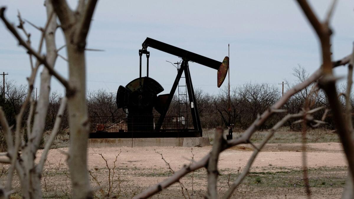 A pump jack drills crude oil from the Yates Oilfield in West Texas’s Permian Basin, near Iraan, Texas. — Reuters