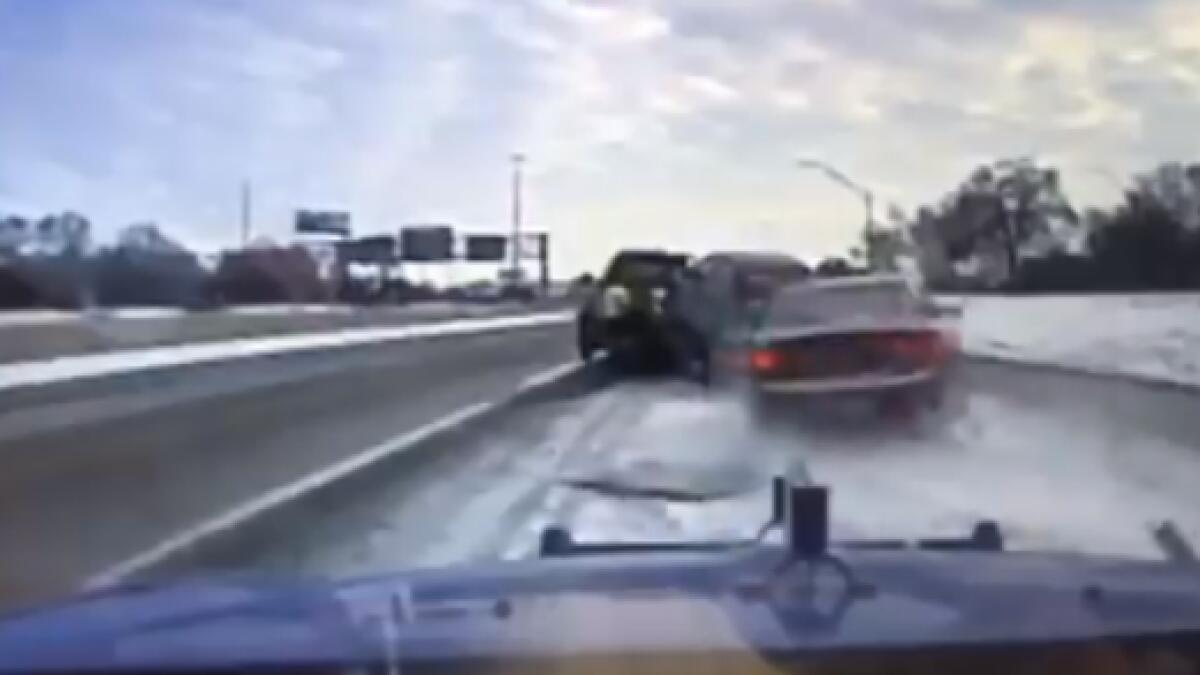 Video: Driver escapes death after car lands on his truck 