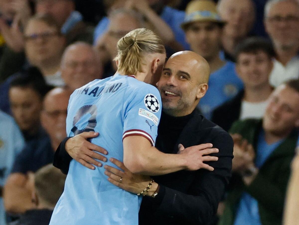 Erling Haaland hugs manager Pep Guardiola after being substituted. — Reuters