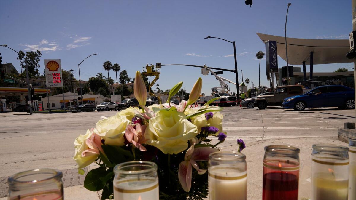 Flowers and candles are left on an intersection after after crash. Photo: AP