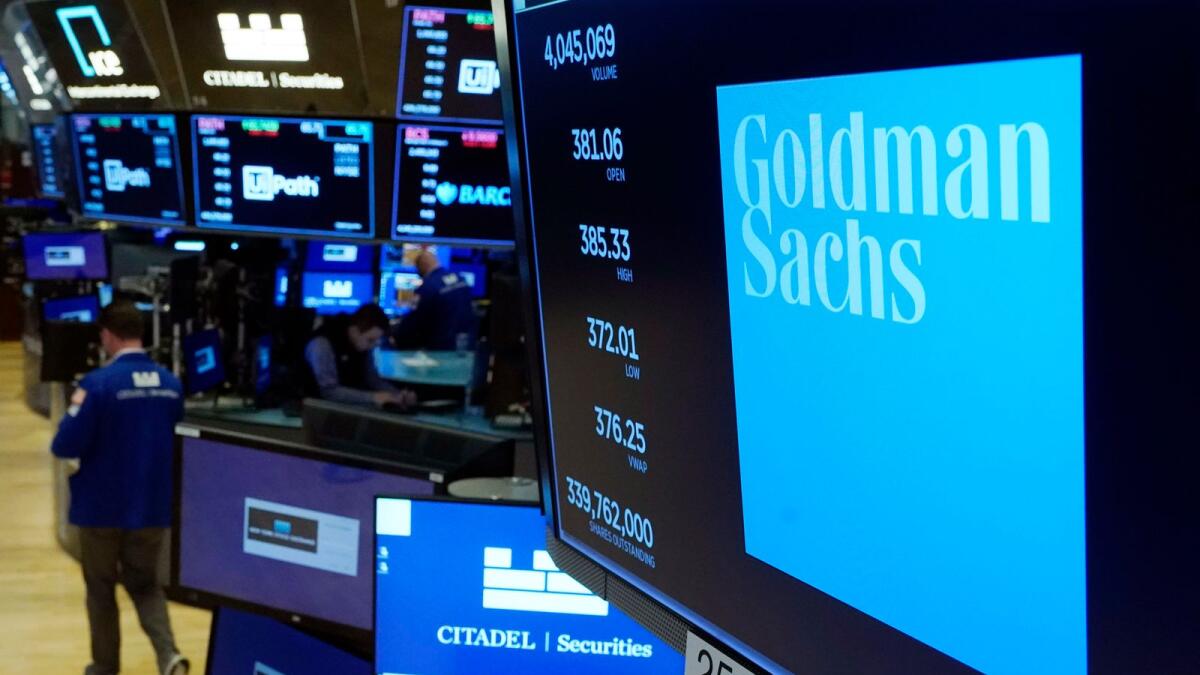 FILE - The logo for Goldman Sachs appears above a trading post on the floor of the New York Stock Exchange. - AP