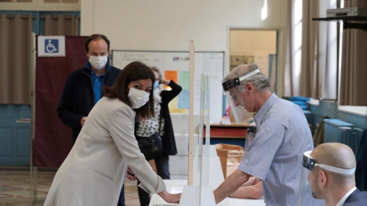 Paris Mayor Anne Hidalgo casts her vote during the second round of the mayoral elections, delayed by more than three months due to the coronavirus disease spread, at the Hotel de Ville in Paris, France. Photo: Reuters
