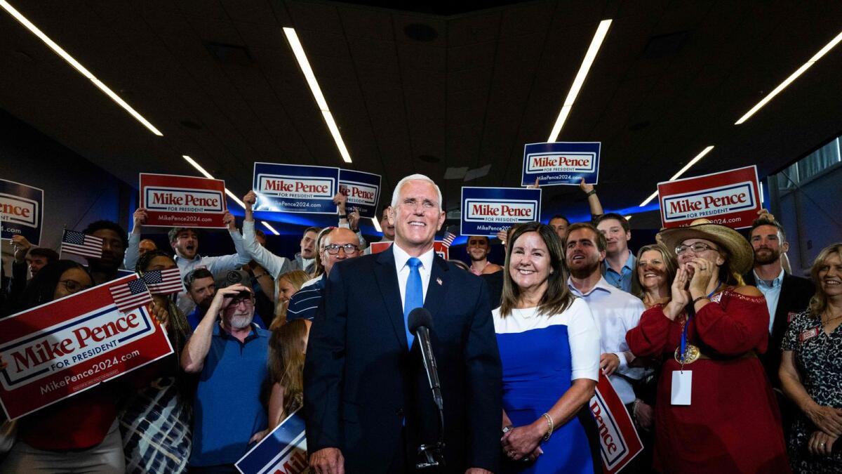 Karen Pence looks on as former US vice-president and 2024 Presidential hopeful Mike Pence is interviewed after his campaign launch event at the FFA Enrichment Centre of the Des Moines Area Community College in Ankeny, Iowa, on Wednesday. -- AP