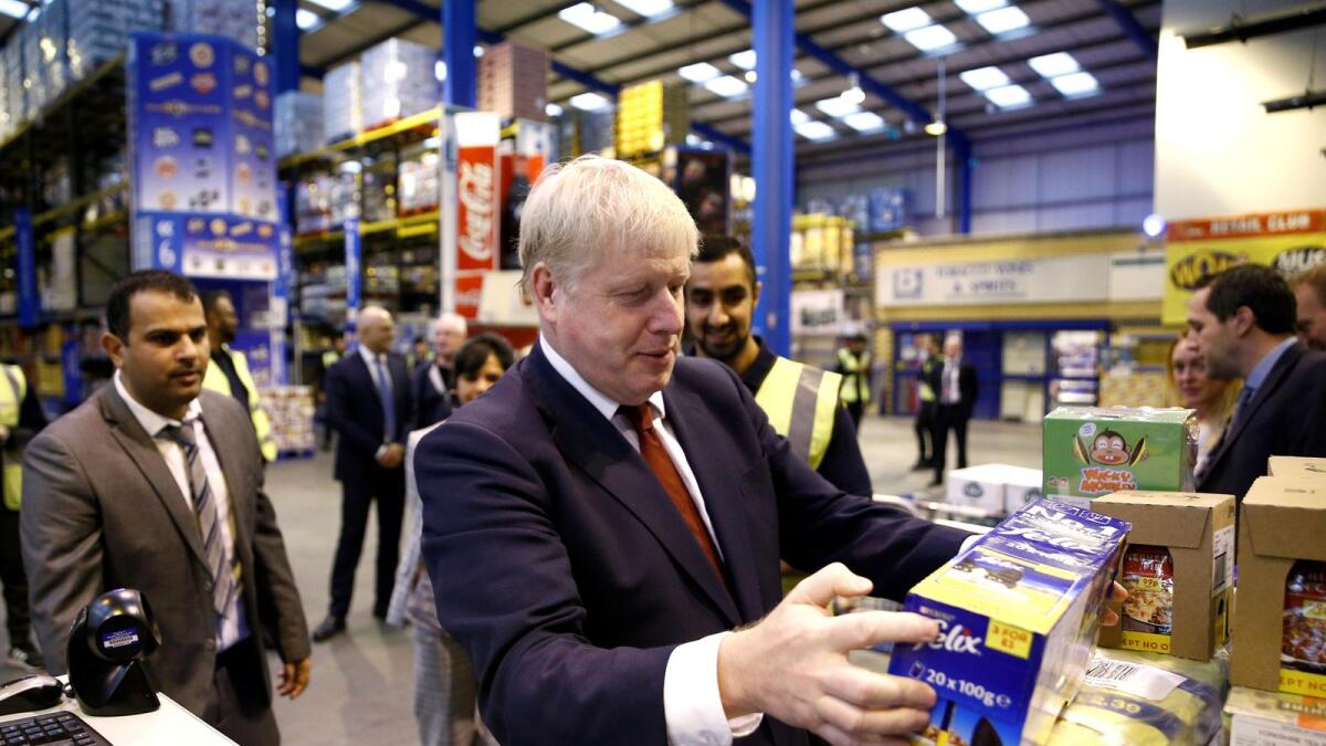 British Prime Minister Boris Johnson during a visit to Bestway Wholesale in Manchester. — Alamy Stock photo