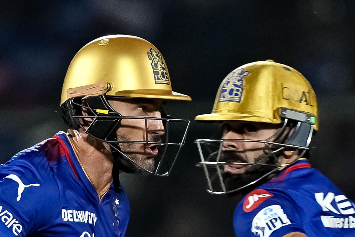 Royal Challengers Bengaluru captain Faf du Plessis (left) and Virat Kohli run between the wickets during the IPL match against Rajasthan Royals. — AFP