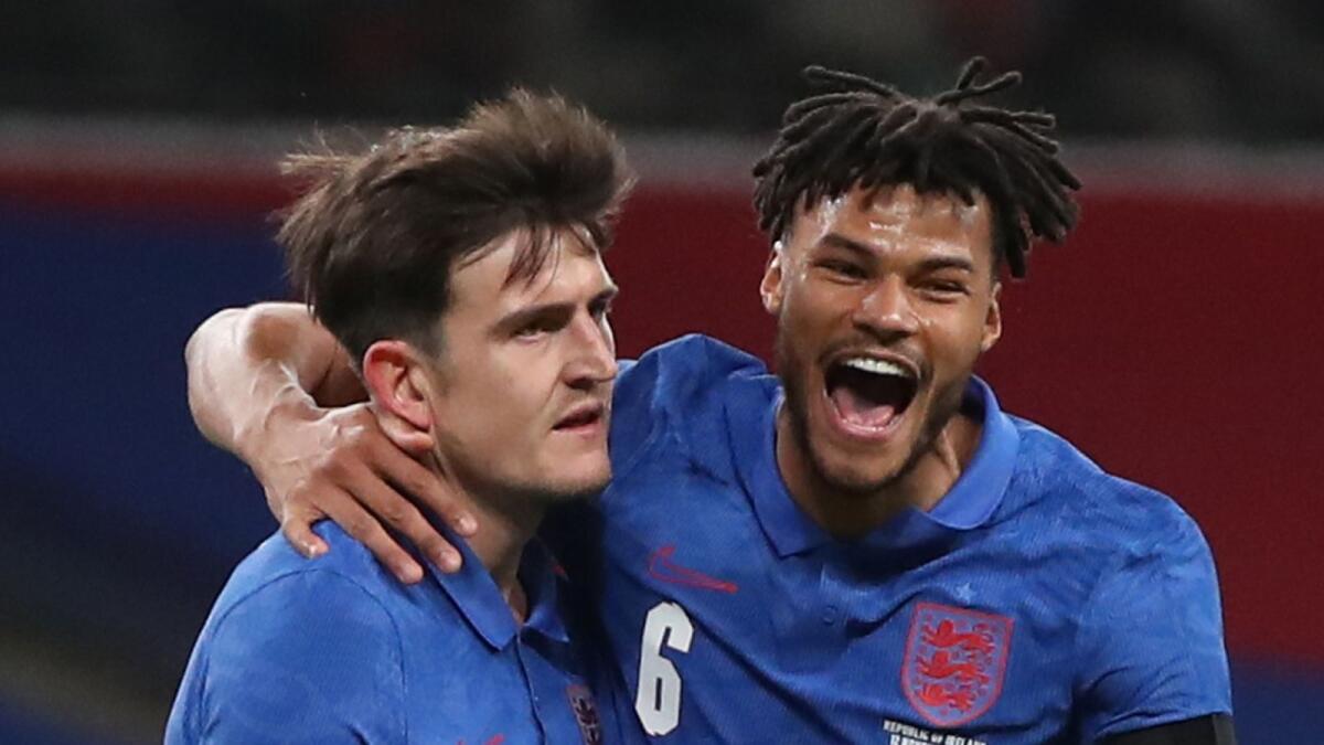 England's Harry Maguire celebrates scoring their first goal with Tyrone Mings. — Reuters