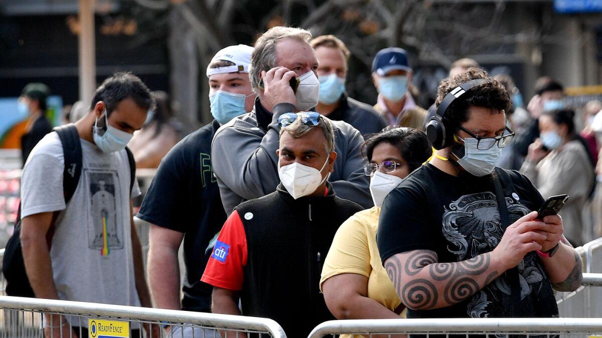 People wait in a queue for their Covid-19 coronavirus vaccination in Sydney. Photo: AFP