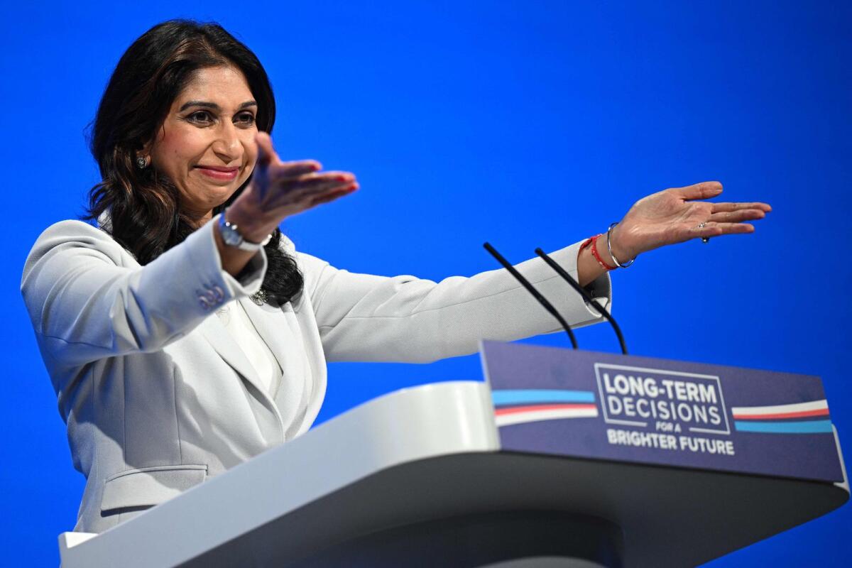 Britain's Home Secretary Suella Braverman addresses delegates at the annual Conservative Party Conference in Manchester, northern England, on October 3, 2023.  — AFP