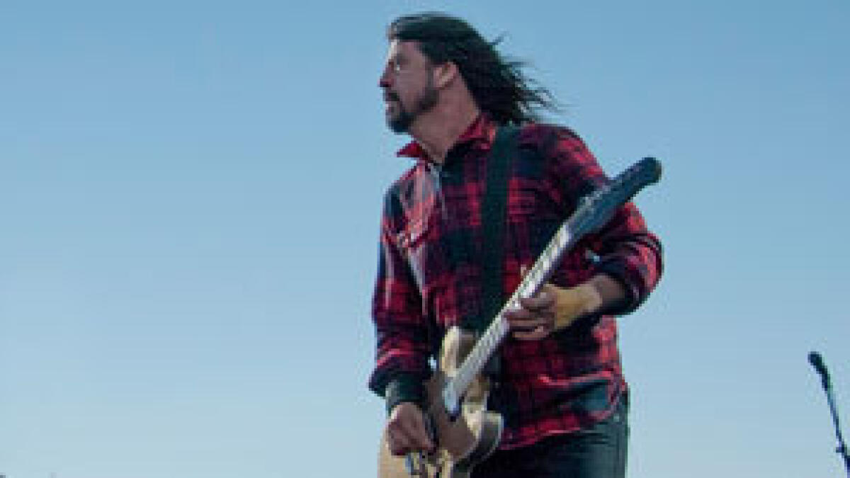 Show goes on with brave Dave Grohl after breaking leg on stage