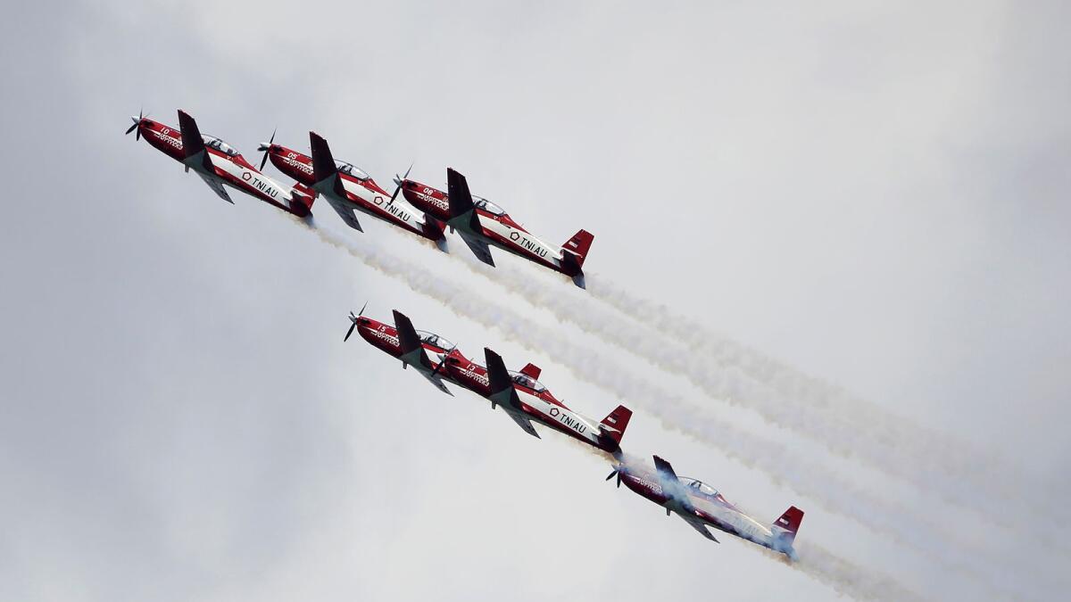 Indonesian Air Force's Jupiter Aerobatic Team takes part in an aerial display during the Singapore Airshow 2022 at Changi Exhibition Centre in Singapore on Tuesday. — AP