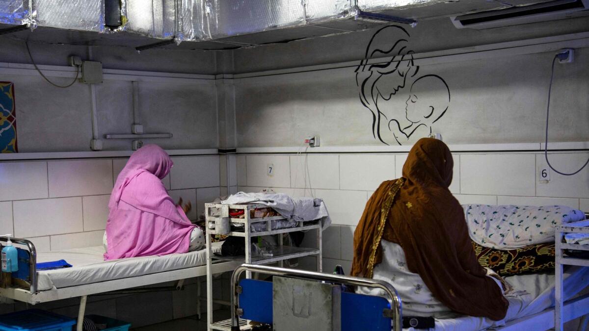 Afghan women sit beside their newborns at the Doctors Without Borders (MSF)-run maternity hospital in Khost. — AFP file