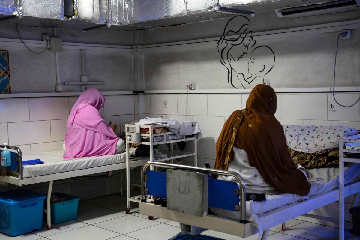 fghan women sit beside their newborns at the Doctors Without Borders (MSF)-run maternity hospital in Khost. — AFP
