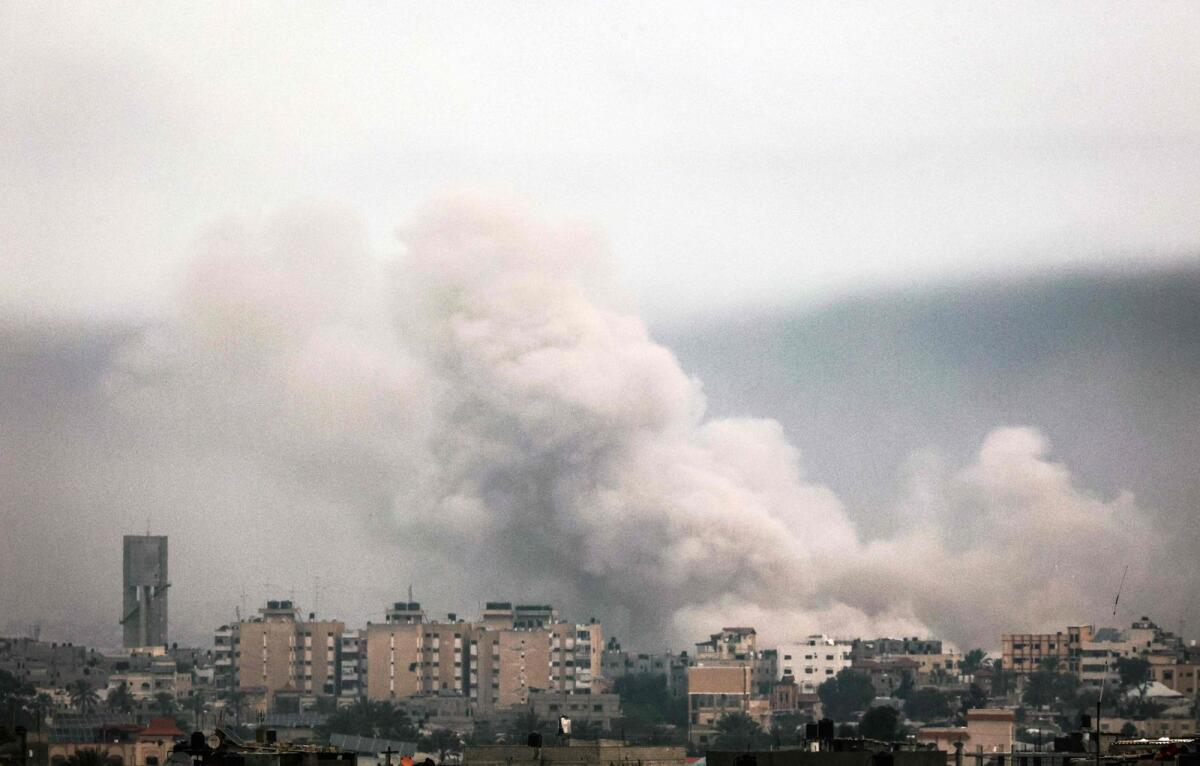 A picture taken from Rafah shows smoke billowing over Khan Yunis in the southern Gaza Strip during Israeli bombardment on January 21, 2024. — AFP