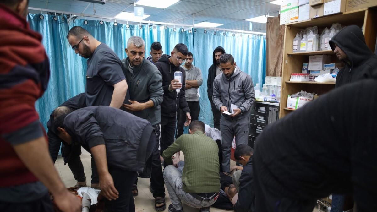 Injured Palestinians receive treatment at a hospital in Deir Al Balah in the central Gaza Strip. — AFP