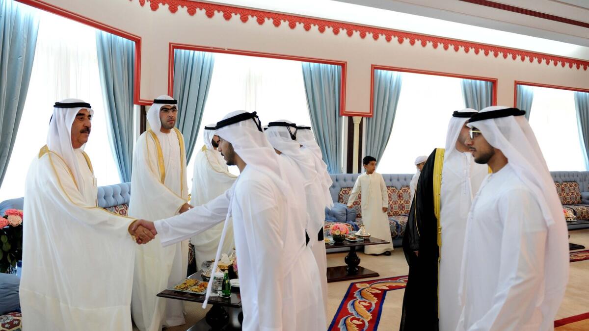 Shaikh Saud bin Rashid receives well-wishers after Eid Al Adha prayers at the Shaikh Zayed Mosque in Umm Al Quwain.