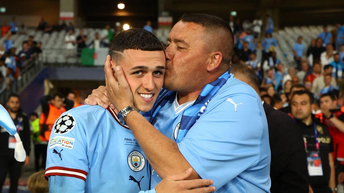 Manchester City's Phil Foden celebrates after historic win.