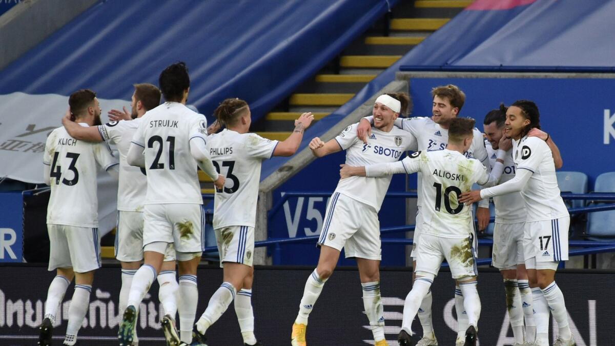 Leeds United's players celebrate a goal against Leicester City.— Reuters