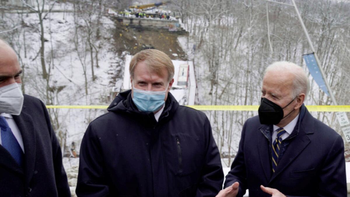 President Joe Biden visits the site where the Fern Hollow Bridge collapsed on Friday. — AP