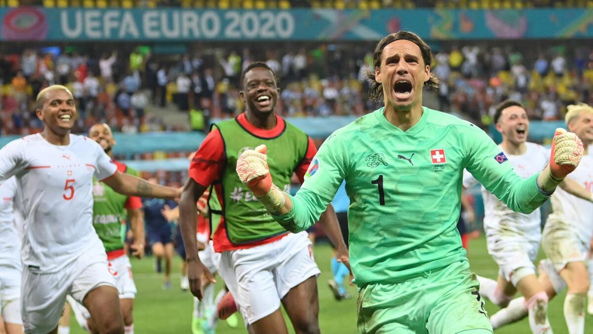 Switzerland goalkeeper Yann Sommer reacts after saving the penalty from France forward Kylian Mbappe in the penalty shootout. (AFP)