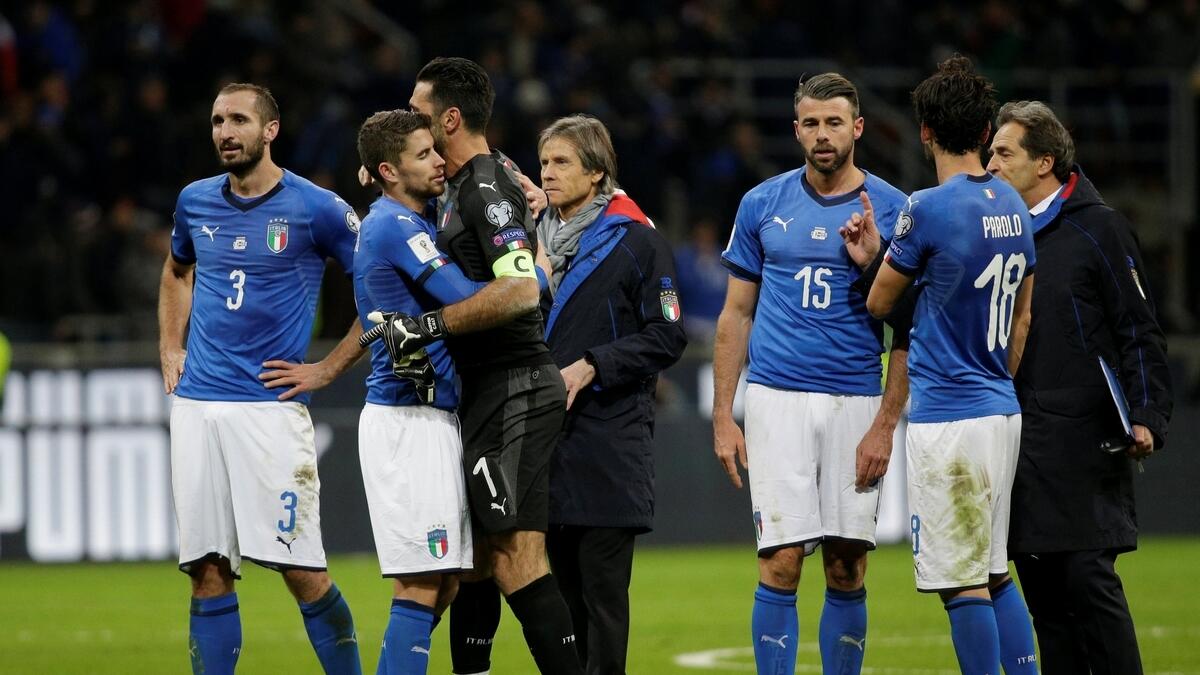 Italy’s Giorgio Chiellini, Gianluigi Buffon and Andrea Barzagli look dejected after the defeat to Sweden in the World Cup qualifying match. Italy failed to qualify for the first time since 1958.