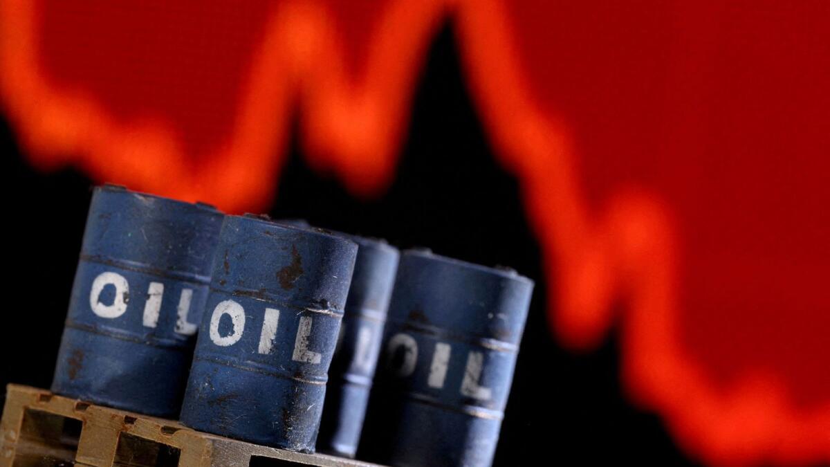 A model of 3D printed oil barrels is seen in front of displayed stock graph going down in this illustration. Brent crude futures fell by 34 cents, or 0.36 per cent, to $92.83 a barrel by 1220GMT. US West Texas Intermediate crude was down 32 cents, or 0.37 per cent, at $86.99. — Reuters