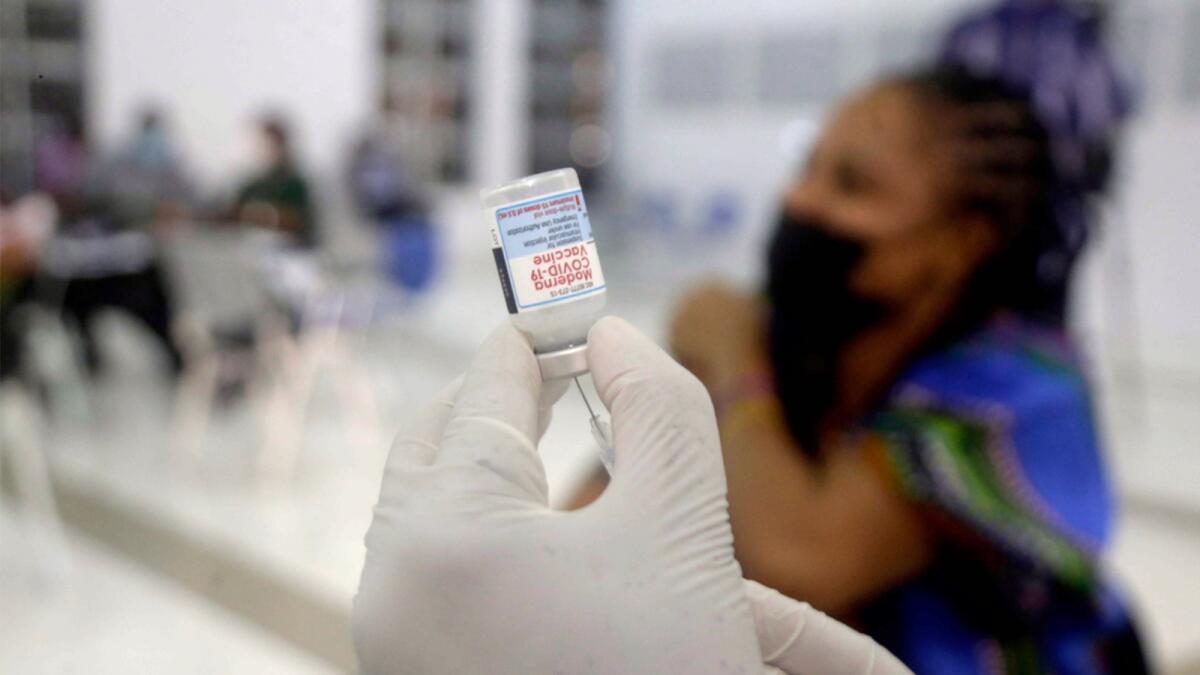 A nurse prepares the Moderna coronavirus vaccine at the health center in Lagos. — AP