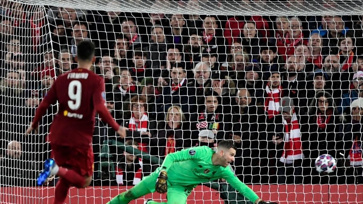 Liverpool's Adrian tracts as Atletico Madrid's Marcos Llorente scores a goal during the UEFA Champions League match at Anfield.
