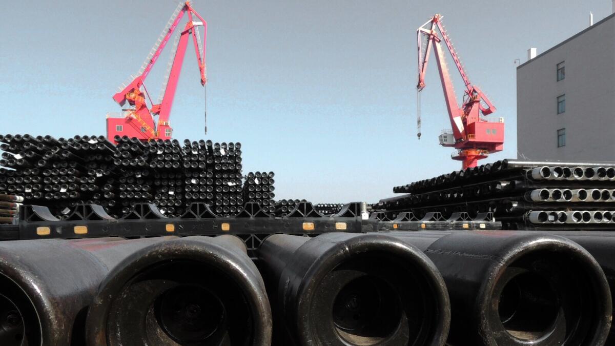 Steel pipes at a port in Lianyungang, Jiangsu province. The Asian Development Bank says China’s economy will expand 6.9 per cent in 2015. — AFP