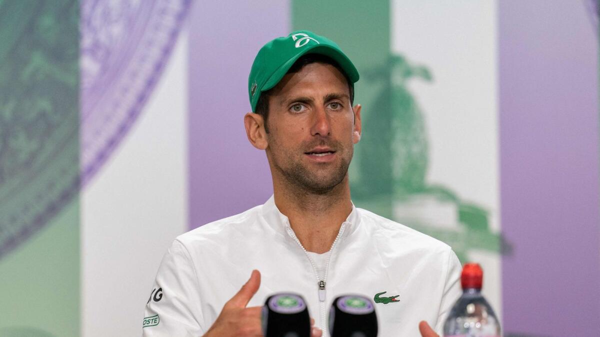 Serbia's Novak Djokovic attends a press conference after winning the final against Italy's Matteo Berrettin. — AFP